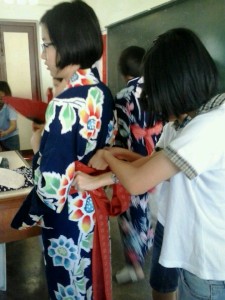 The committees were helping the member to wear their Yukata.